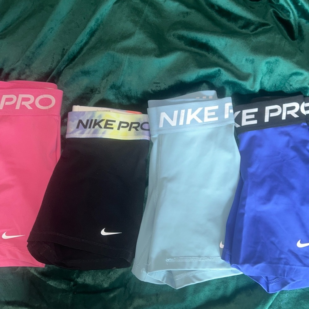 4 pairs of small Nike pros all good condition